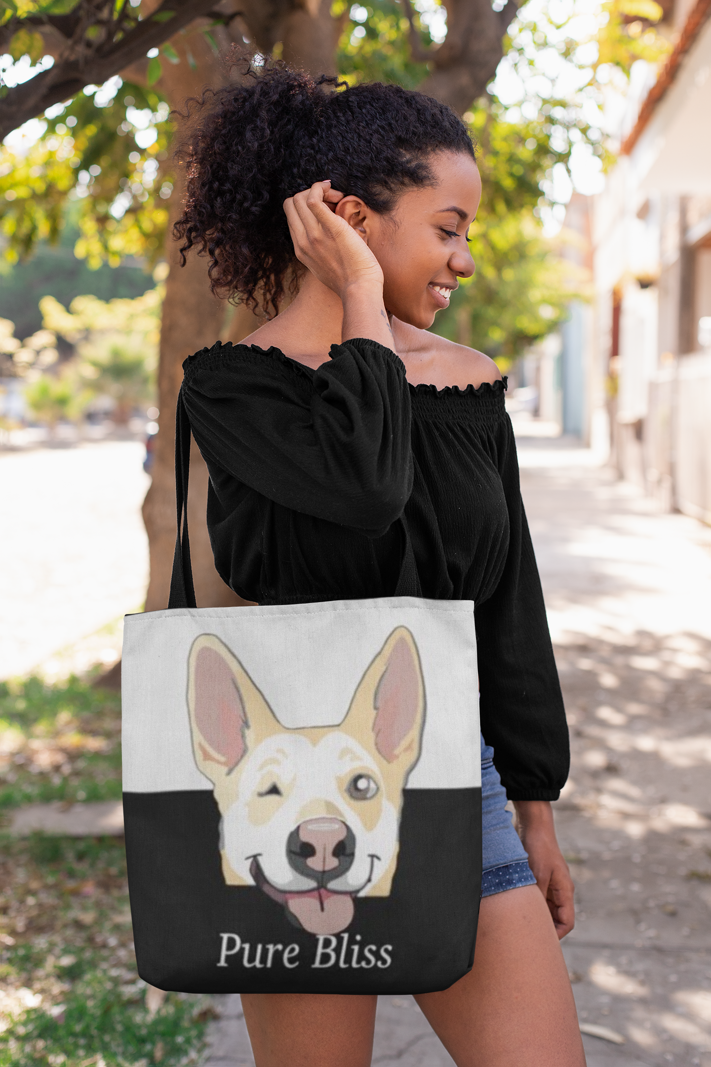 Woman standing outdoors carrying Pure Bliss Nico Face all-over print tote bag