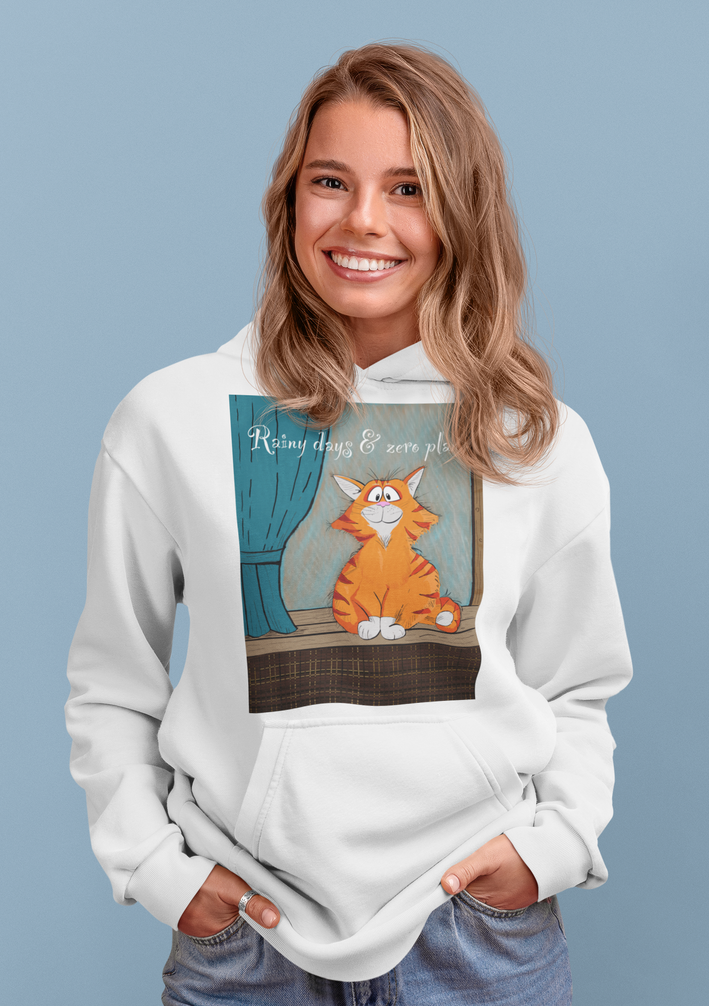 Smiling woman with dirty blonde hair wearing white Rainy Days & Zero Plans cat hoodie