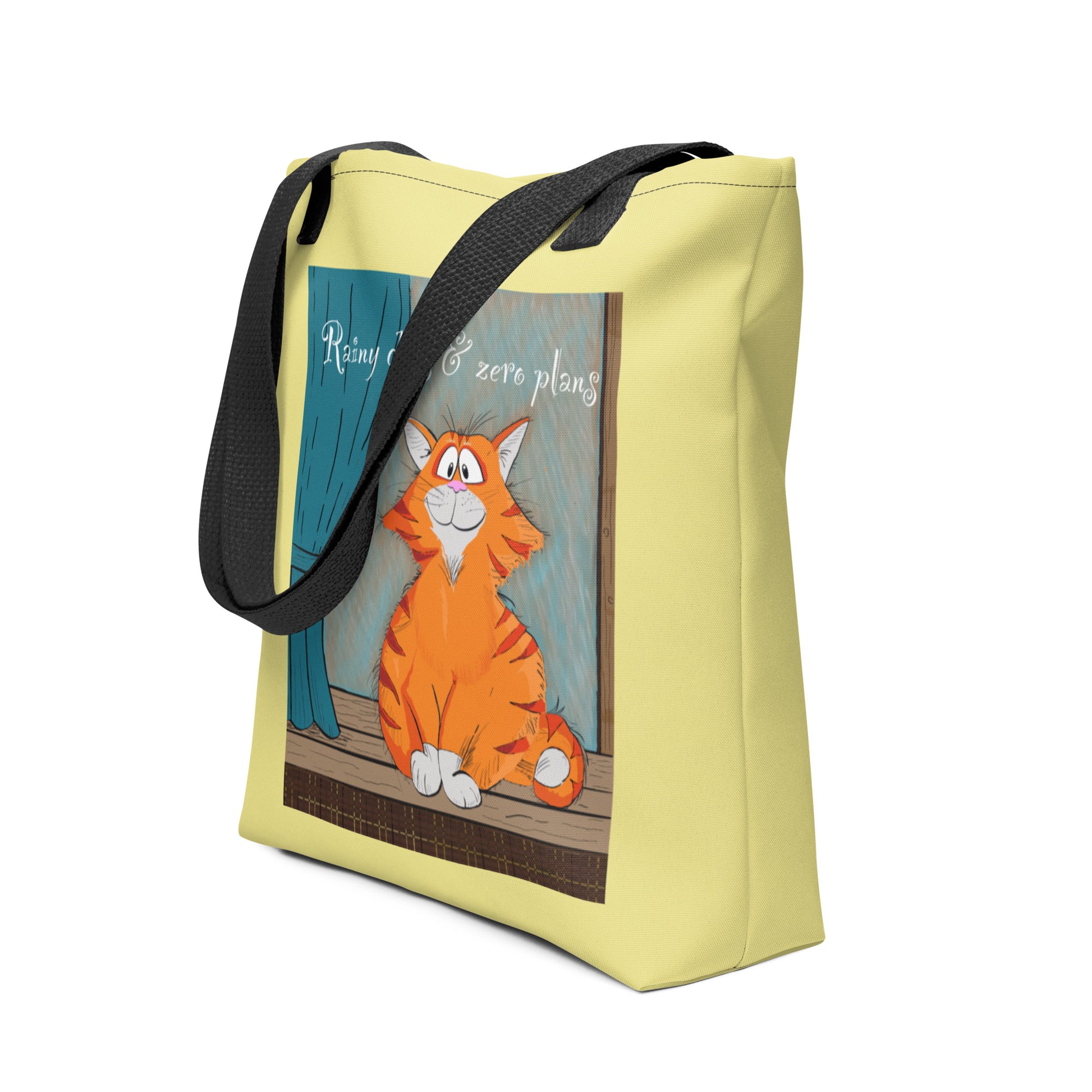 Side view of Rainy Days & Zero Plans cat tote bag showing the full design and strap