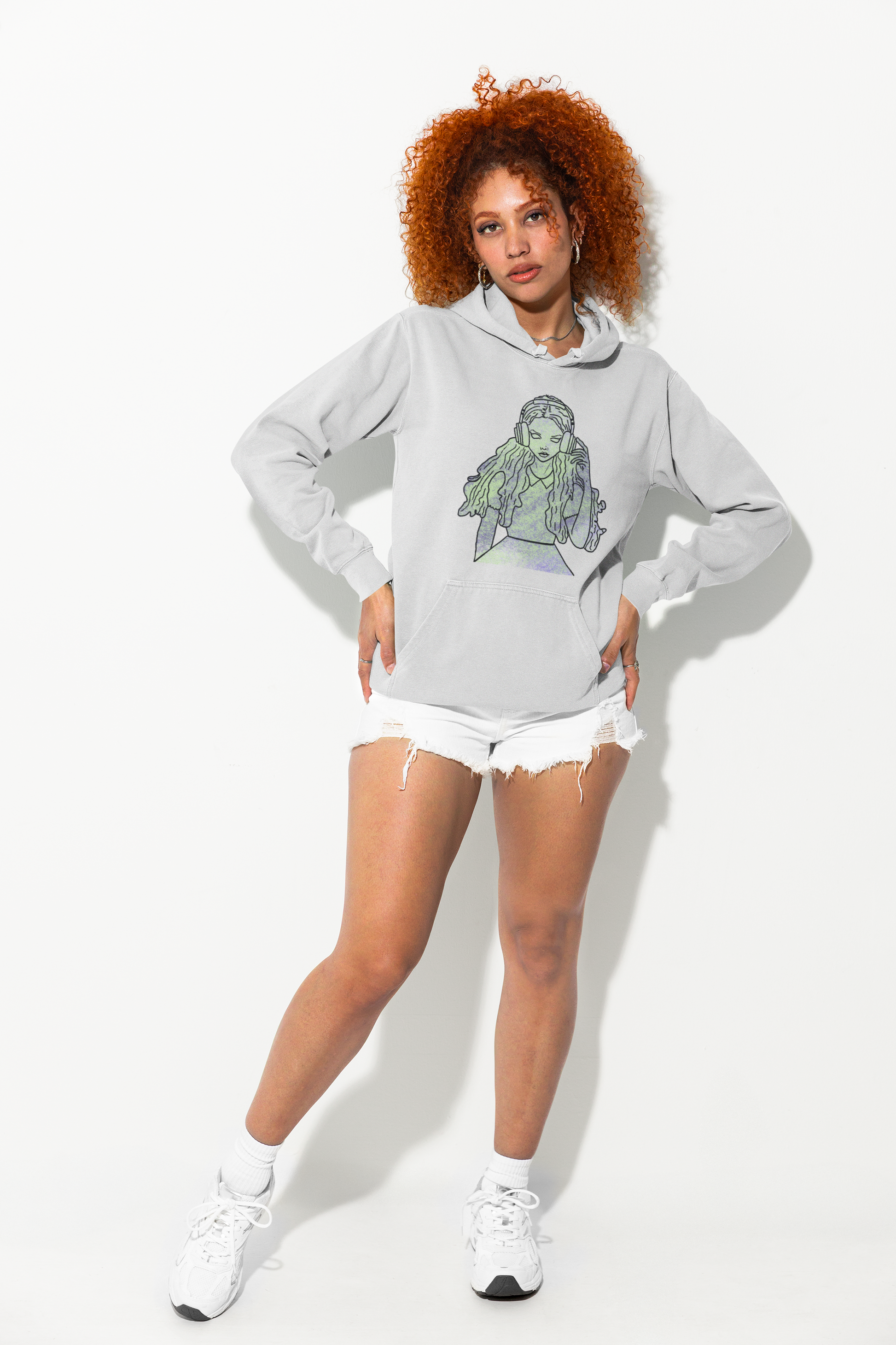 Woman in shorts wearing ash Gildan hoodie with That Girl, Alice grunge-cute Wonderland design. Whimsical, edgy, and self-taught art for the curious and bold.