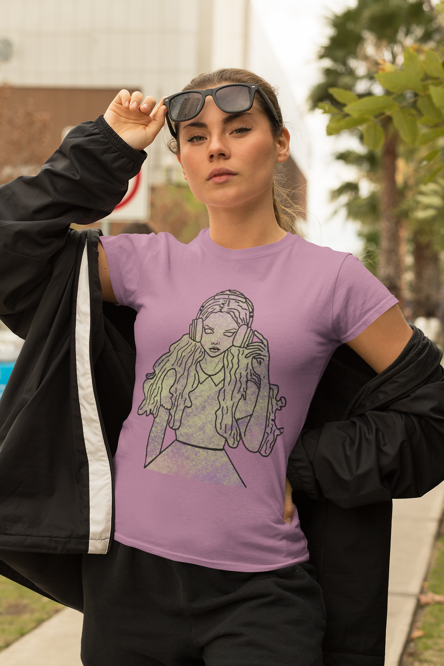 Girl with sunglasses wearing heather team purple Bella Canvas t-shirt featuring That Girl, Alice grunge-cute Wonderland design. Bold, whimsical, and full of attitude for the curious ones.