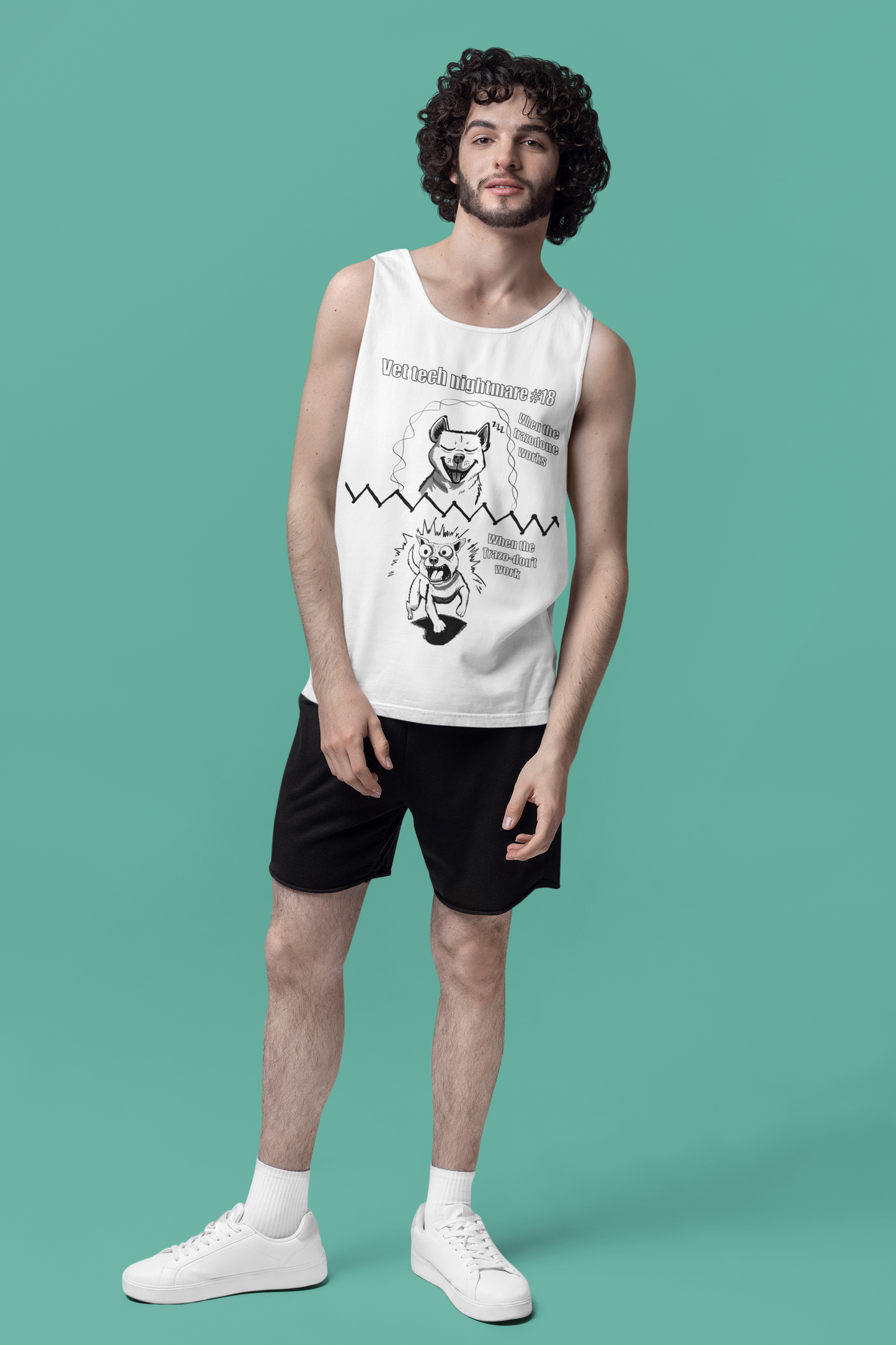 Man standing in studio wearing a white Comfort Colors 9360 tank top with Vet Tech Nightmare #18 design showing the "When the Trazodone Works" and "When the Trazo-Don't Work" panels.