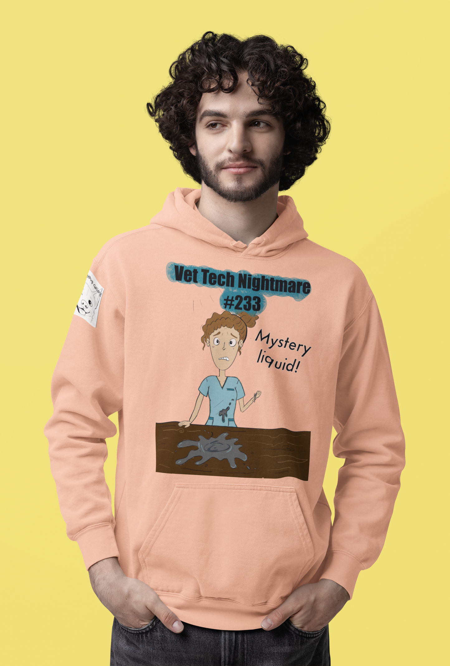 Man with curly hair wearing peach Comfort Colors hoodie featuring Vet Tech Nightmare #233 Mystery Liquid artwork