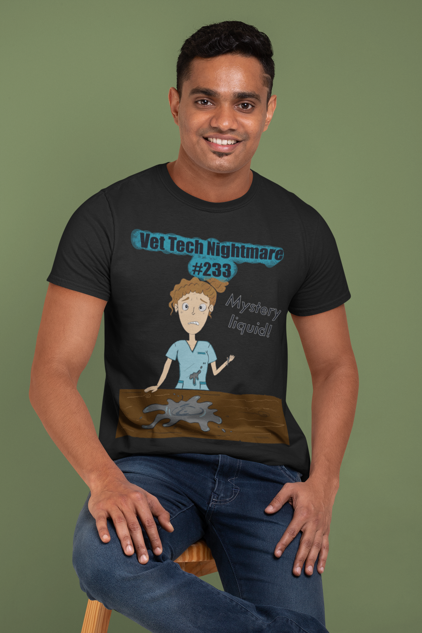 Man smiling in studio wearing black t-shirt featuring Vet Tech Nightmare #233 Mystery Liquid design
