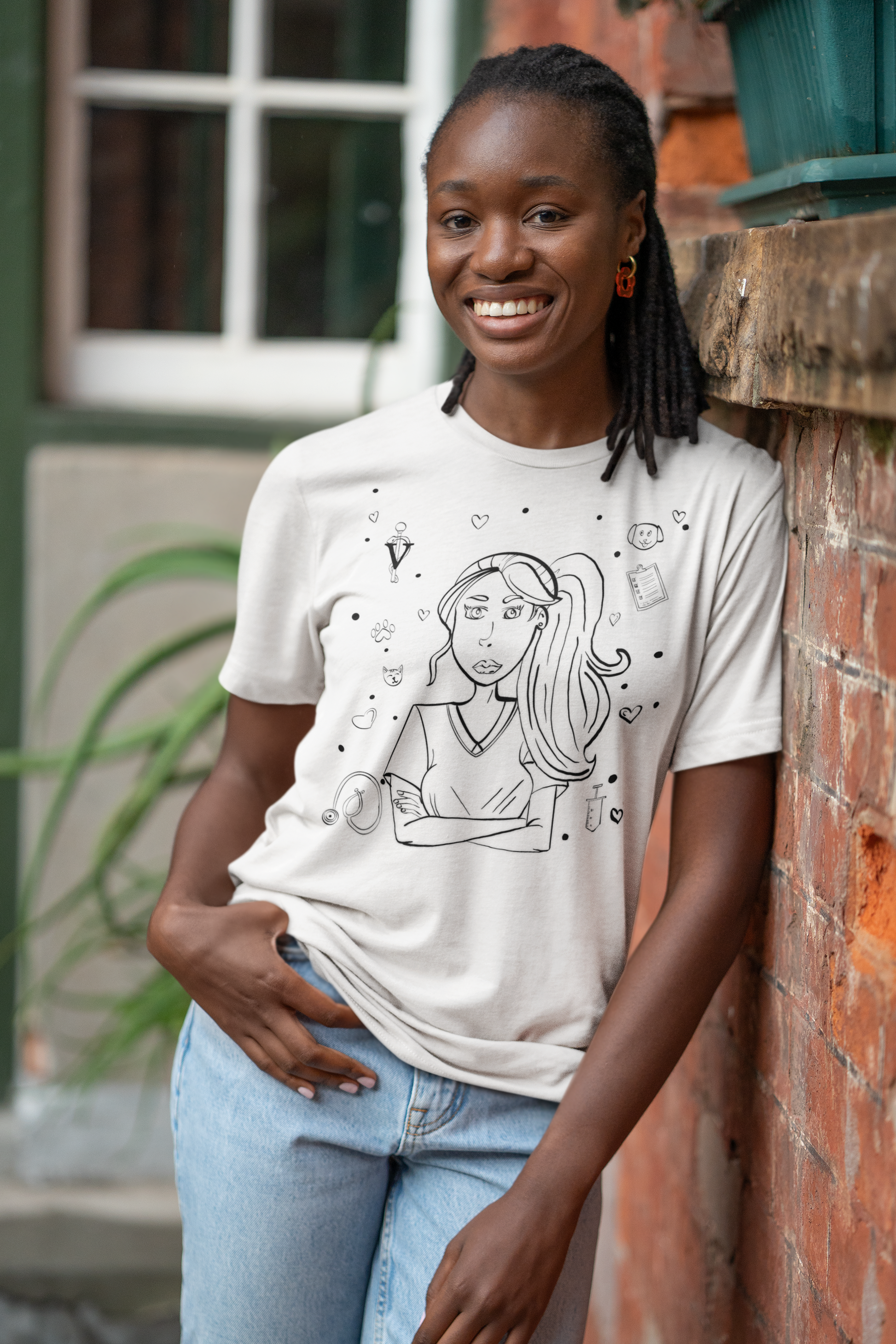 Woman leaning on wall in white "Vet Vibe Girl" t-shirt with vet tech illustration – GrungePup Vet Chaos sarcastic veterinary tee