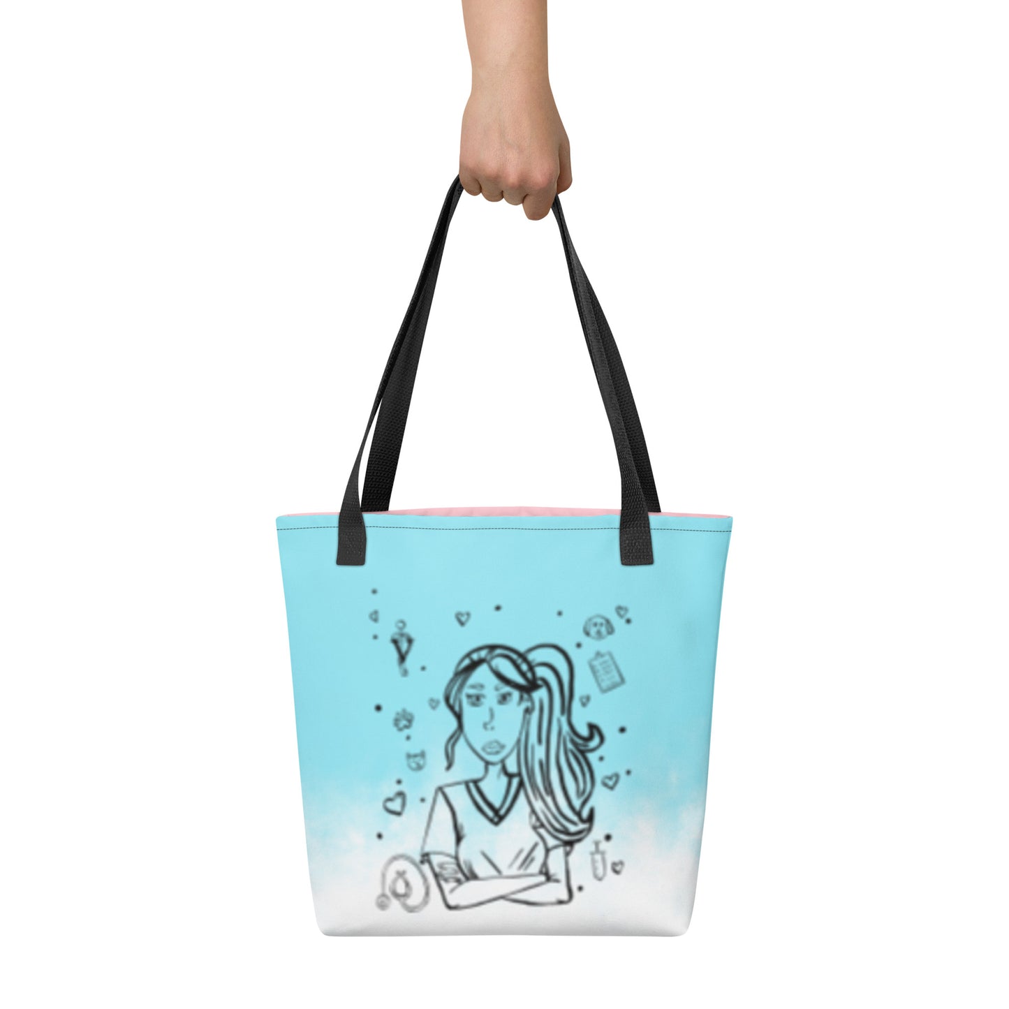 Front view of the Vet Vibe all-over print tote bag in blue featuring the darkened line-art vet girl design with hearts, paw prints, and medical icons, held by a hand against a white background.