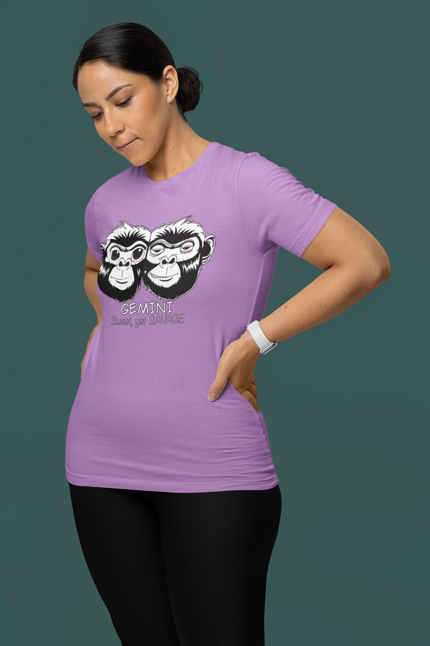 Woman standing confidently in front of a teal background wearing a heather team purple Gemini Sweet Yet Savage t-shirt