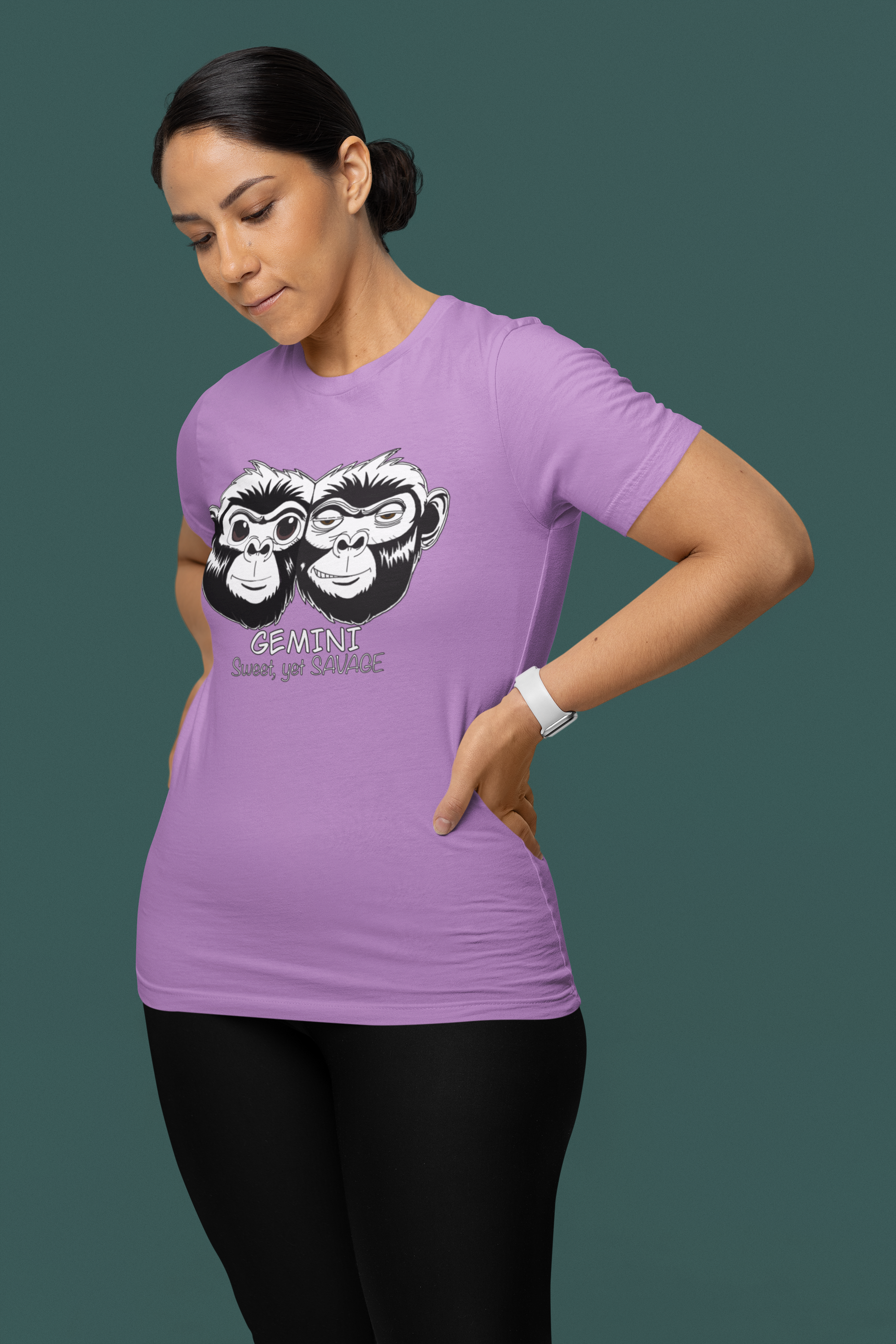 Woman standing confidently in front of a teal background wearing a heather team purple Gemini Sweet Yet Savage t-shirt