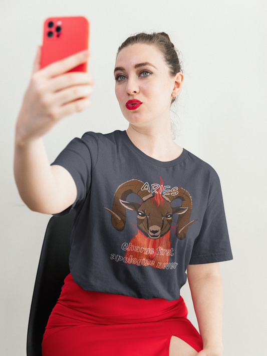 Woman with red lips taking a selfie while wearing a heather navy Bella + Canvas t-shirt with Aries ram artwork