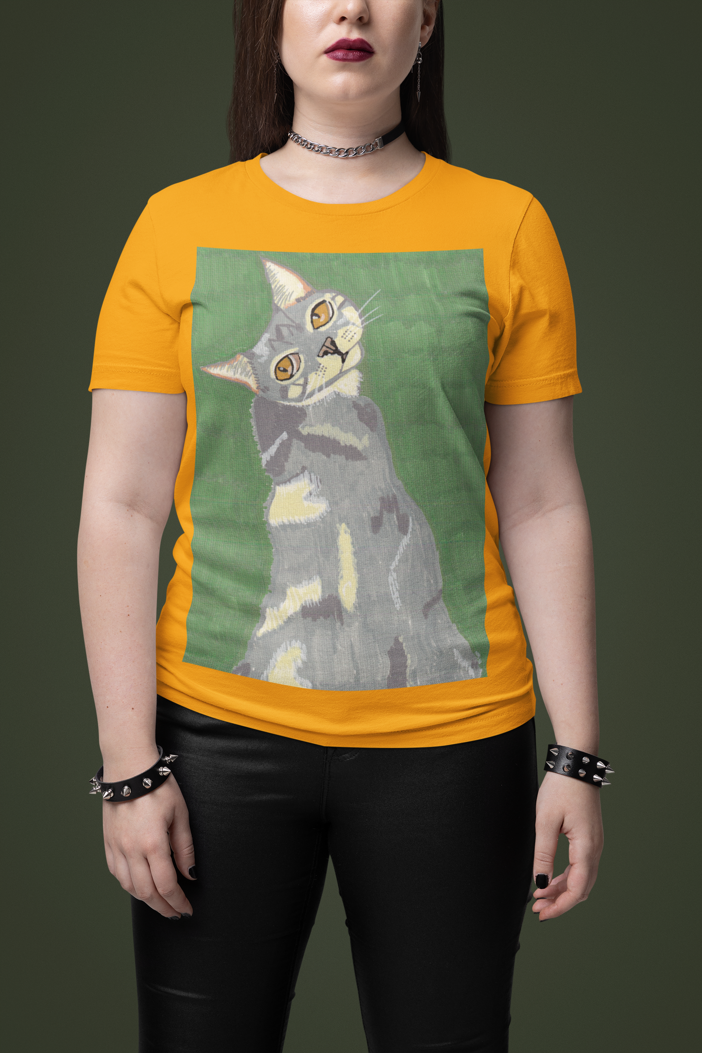 Woman with red lips wearing a gold yellow Bella + Canvas t-shirt featuring the Mr. Grey cat portrait from GrungePup Paws N' Chaos