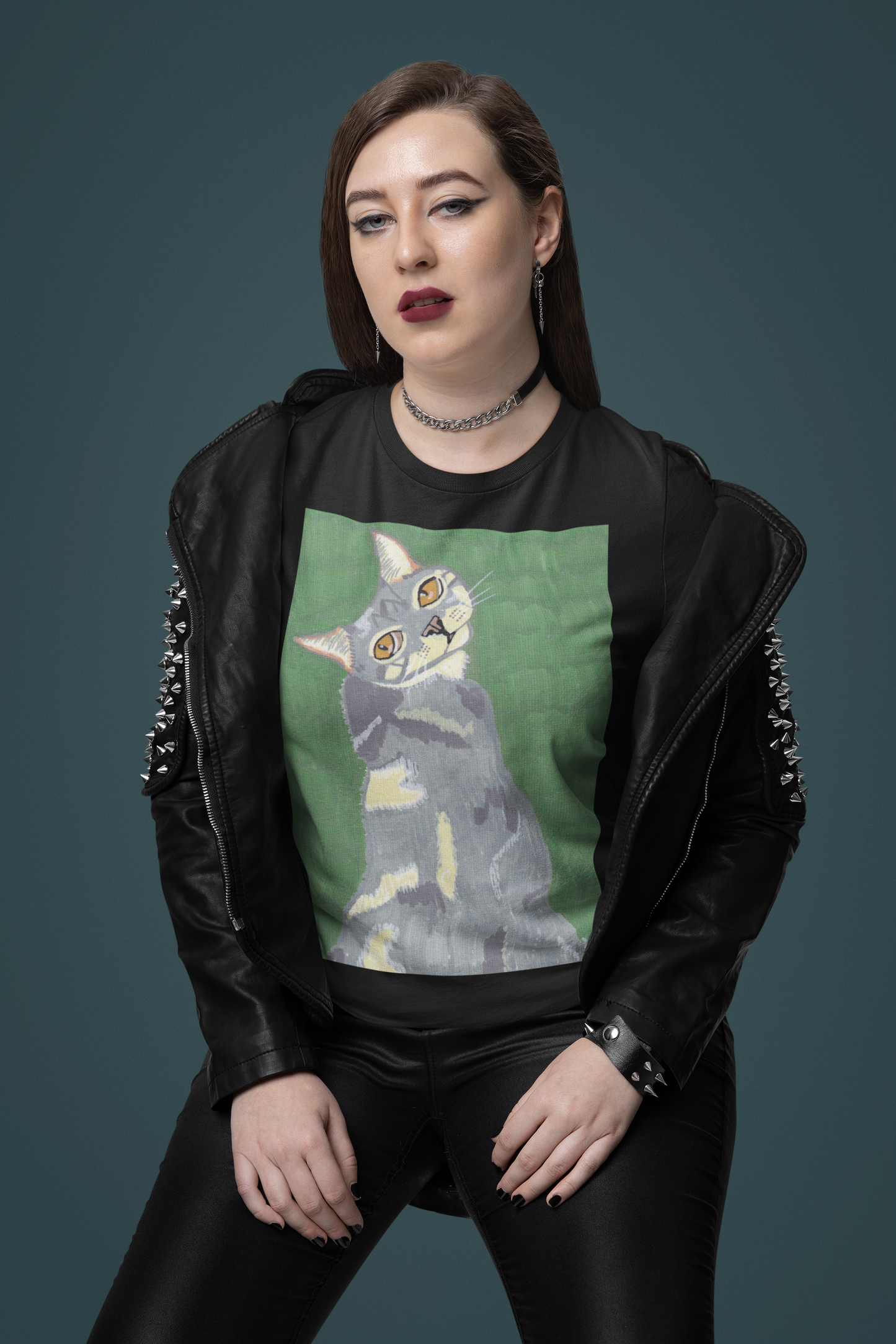 Woman with heavy makeup and black leather jacket wearing a black Bella + Canvas t-shirt with Mr. Grey cat portrait
