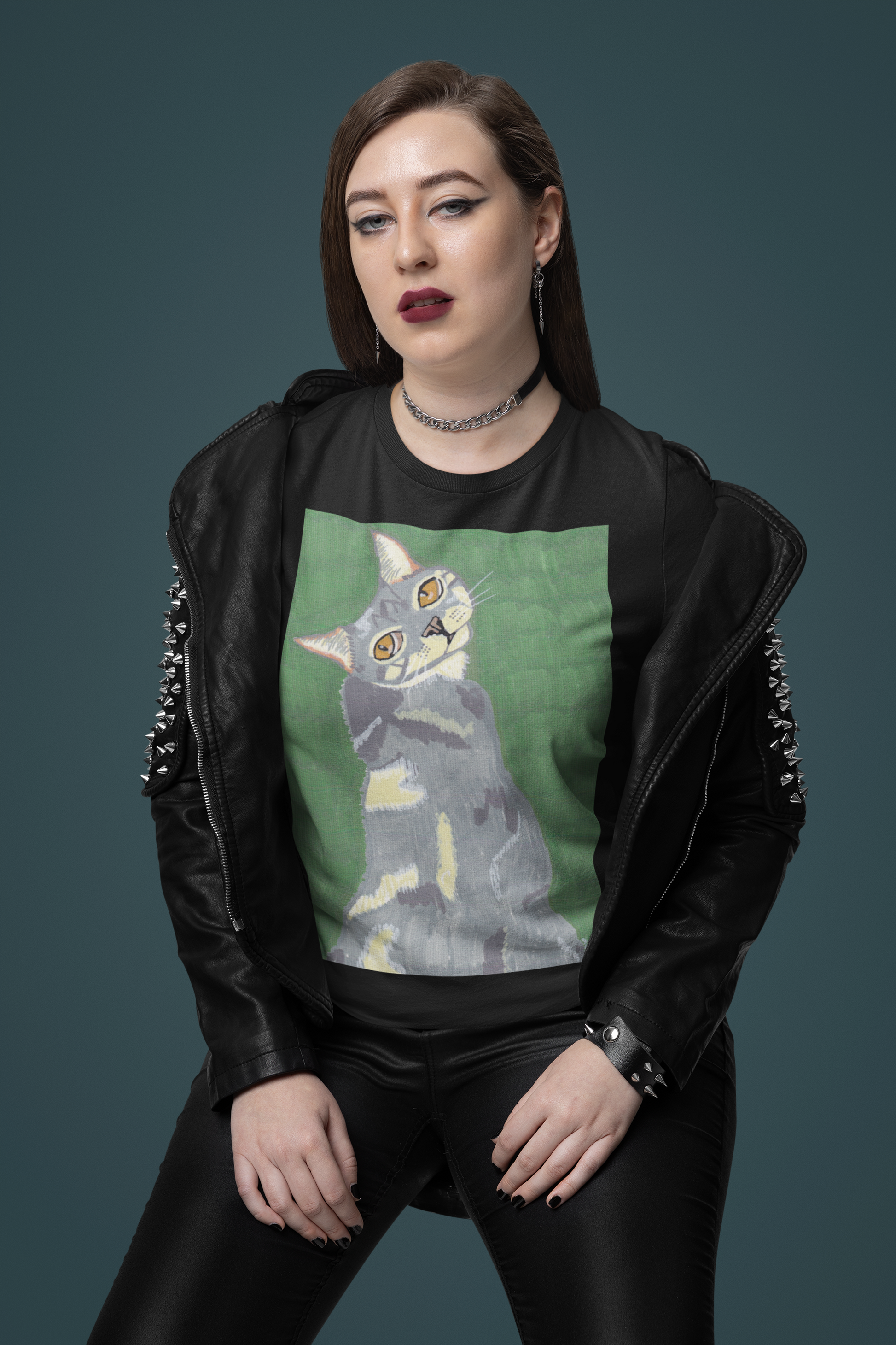 Woman with heavy makeup and black leather jacket wearing a black Bella + Canvas t-shirt with Mr. Grey cat portrait