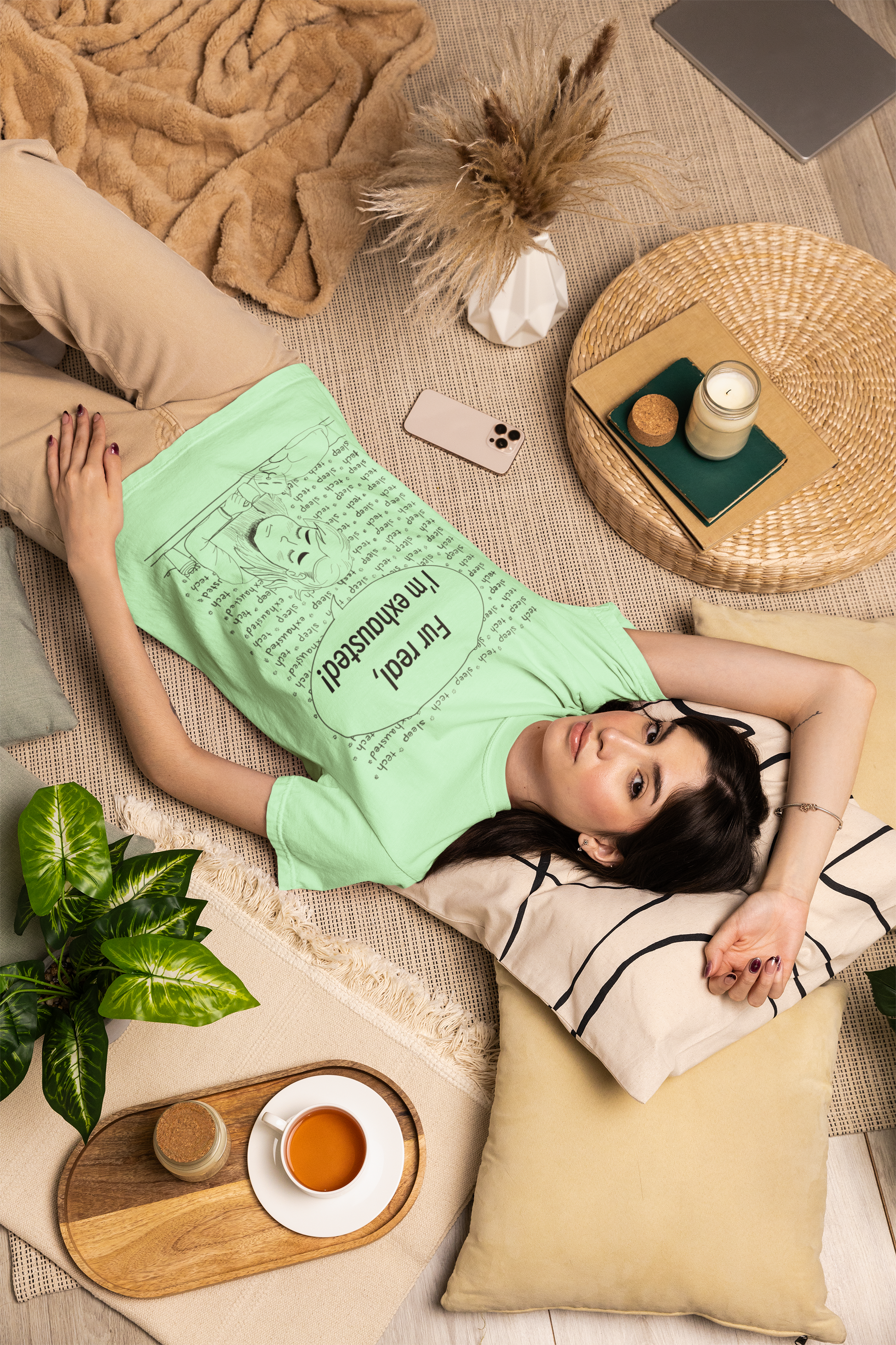 Woman with dark hair lying on the floor wearing an island reef green Fur Real, I'm Exhausted t-shirt