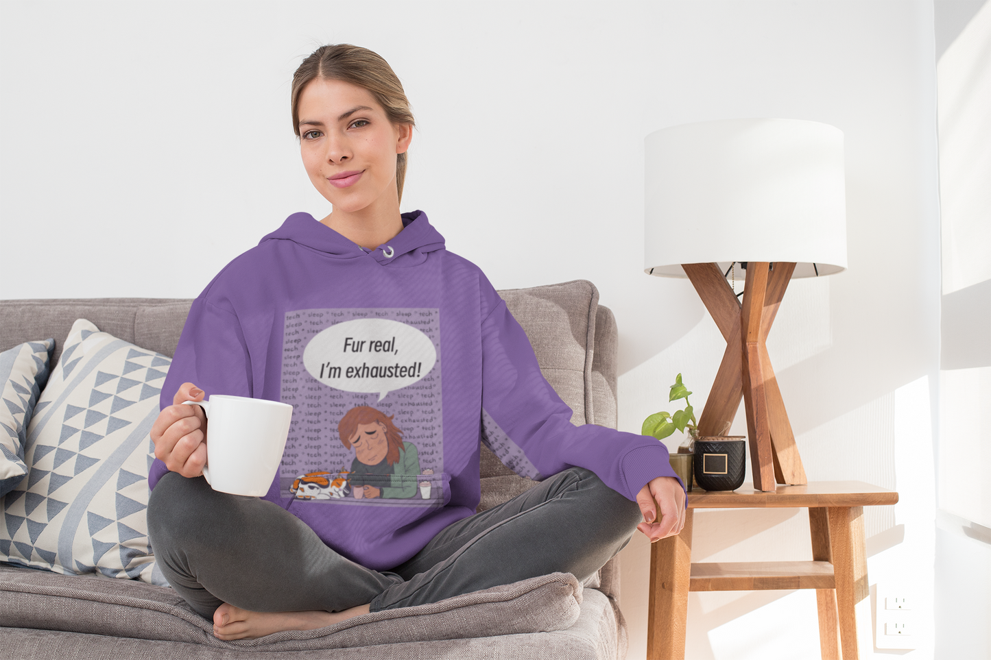 Woman sitting cross legged on couch with coffee mug wearing purple "Fur Real, I'm Exhausted" hoodie – GrungePup Vet Chaos sarcastic design