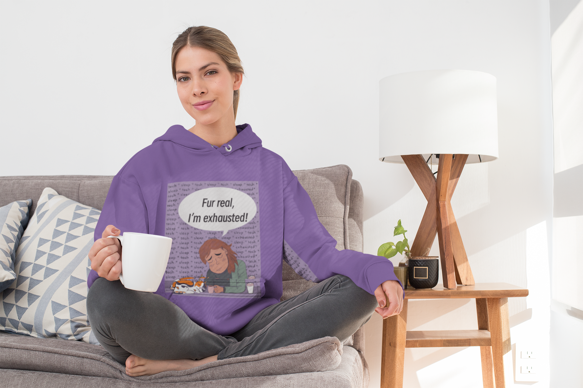 Woman sitting cross legged on couch with coffee mug wearing purple "Fur Real, I'm Exhausted" hoodie – GrungePup Vet Chaos sarcastic design