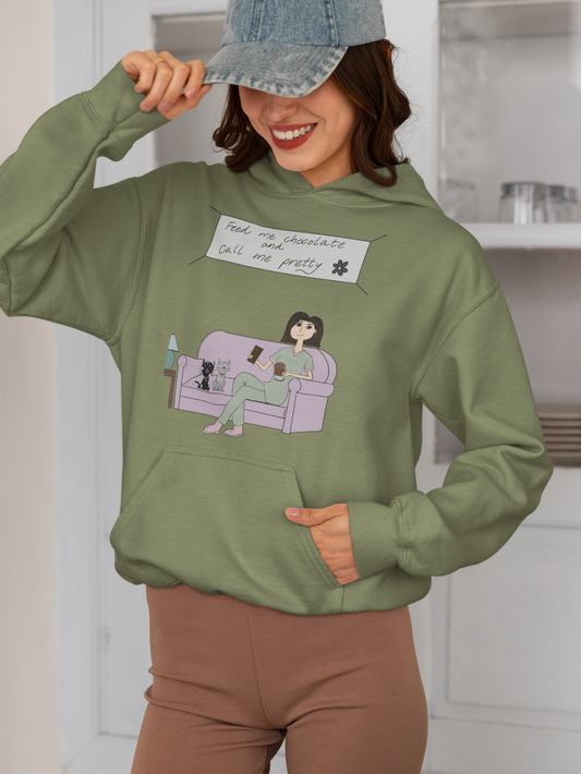 Smiling woman wearing a military green Feed Me Chocolate and Call Me Pretty hoodie